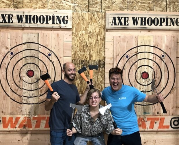 Three People Group at Axe Throwing Event